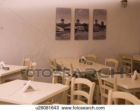 Empty table and chairs in Mykonos Greece View Large Photo Image Stock Image - Empty table and chairs in Mykonos Greece. Fotosearch