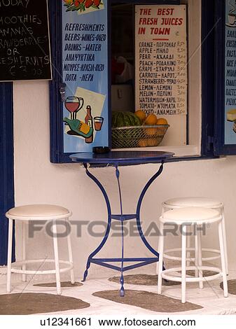 Empty table and stools in Mykonos Greece View Large Photo Image Stock Image - Empty table and stools in Mykonos Greece. Fotosearch
