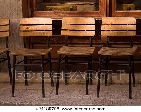Stock Photo - Empty wooden chairs in Kusadasi Turkey. Fotosearch