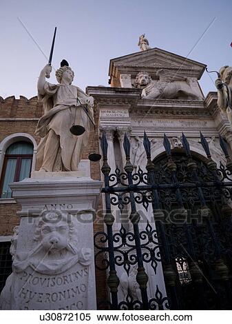 Stock Photography - Iron gate and statue in Venice. Fotosearch