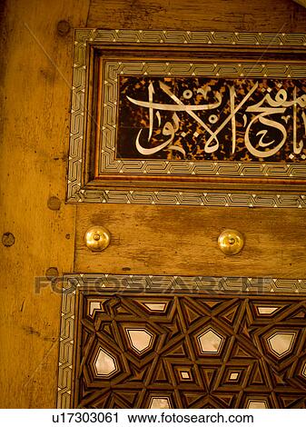 Stock Image - Knobs on door in Kusadasi Turkey. Fotosearch