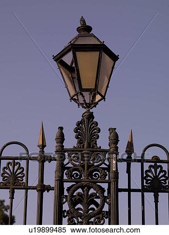 Stock Photography - Lamp on iron fence in Naples. Fotosearch