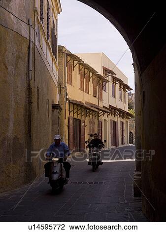People riding scooters in Rhodes Greece View Large Photo Image Stock Image - People riding scooters in Rhodes Greece. Fotosearch