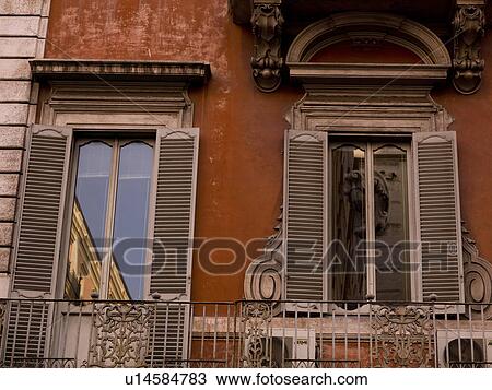 Stock Image - Shuttered windows in Rome Italy. Fotosearch