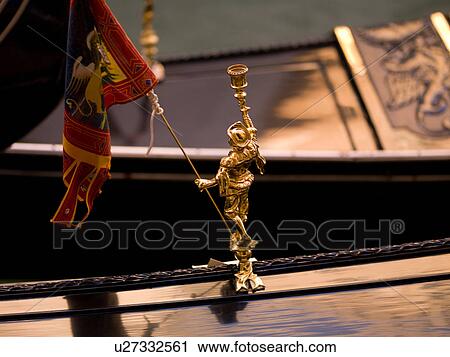 Stock Image - Statue ornament on Venetian gondola. Fotosearch