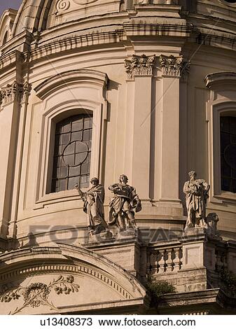 Stock Image - Statues on ancient building in Rome Italy. Fotosearch