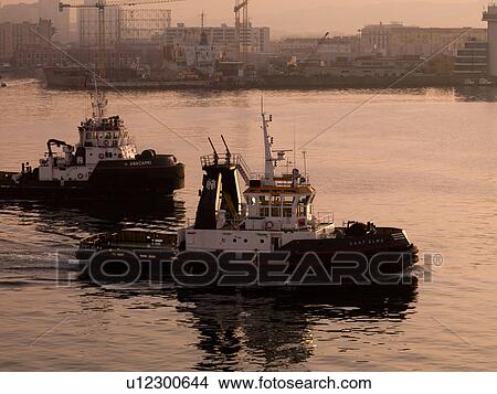Tug boats along the Naples shoreline View Large Photo Image Picture - Tug boats along the Naples shoreline. Fotosearch