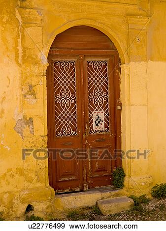 Stock Photo - Weathered yellow wall in Rhodes Greece. Fotosearch
