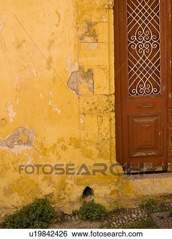 Weathered yellow wall in Rhodes Greece View Large Photo Image Stock Photograph - Weathered yellow wall in Rhodes Greece. Fotosearch
