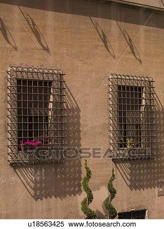 Windows with bars in Rome Italy View Large Photo Image Stock Photography - Windows with bars in Rome Italy. Fotosearch