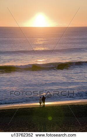 A Couple at the Beach at Dawn View Large Photo Image Stock Image - A Couple at the Beach at Dawn. Fotosearch