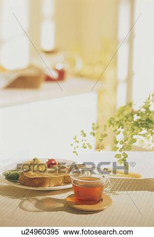 Stock Photography - A cup of tea and French toast for breakfast. Fotosearch