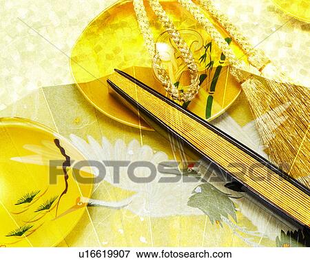 Stock Photo - A fan and a clam shell game. Fotosearch