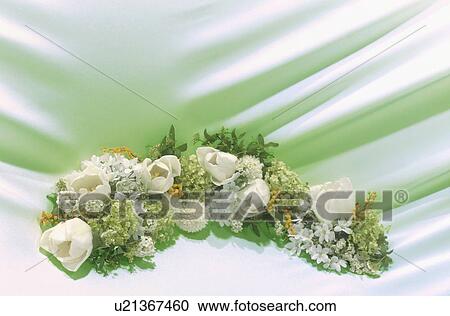 A large arrangement of flowers against a draped cloth background View Large Photo Image Stock Image - A large arrangement of flowers against a draped cloth background. Fotosearch