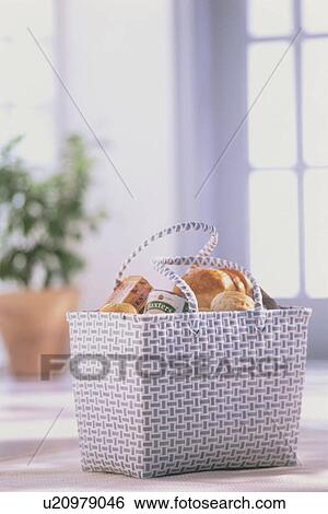 A shopping basket full of groceries View Large Photo Image Stock Photograph - A shopping basket full of groceries. Fotosearch