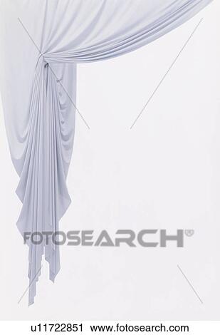 Stock Image - An elegantly-draped cloth hanging. Fotosearch