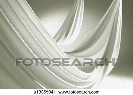 Stock Image - An elegantly-draped cloth hanging. Fotosearch