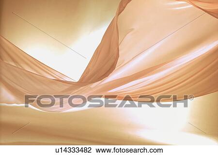 Stock Image - An elegantly-draped cloth hanging. Fotosearch