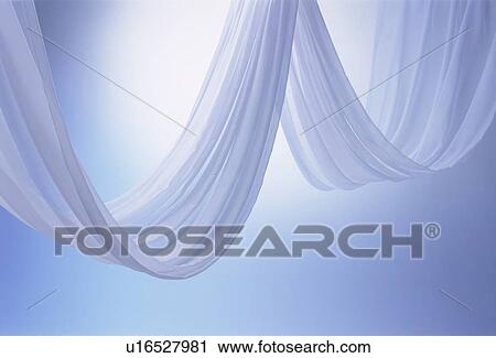 Stock Image - An elegantly-draped cloth hanging. Fotosearch