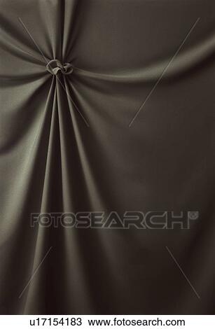 Stock Image - An elegantly-draped cloth hanging. Fotosearch