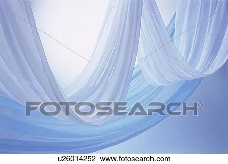 Stock Image - An elegantly-draped cloth hanging. Fotosearch