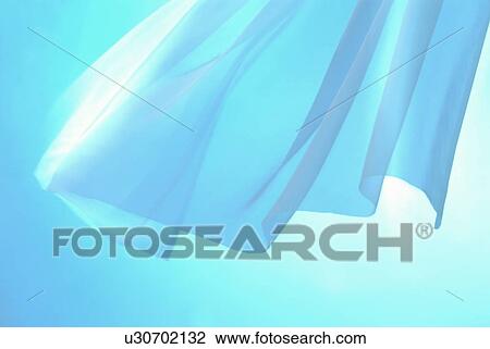 Stock Image - An elegantly-draped cloth hanging. Fotosearch