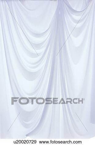 Stock Photo - An elegantly-draped cloth hanging. Fotosearch