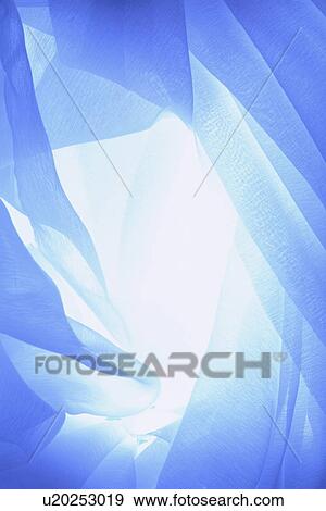 Stock Photo - An elegantly draped cloth hanging. Fotosearch