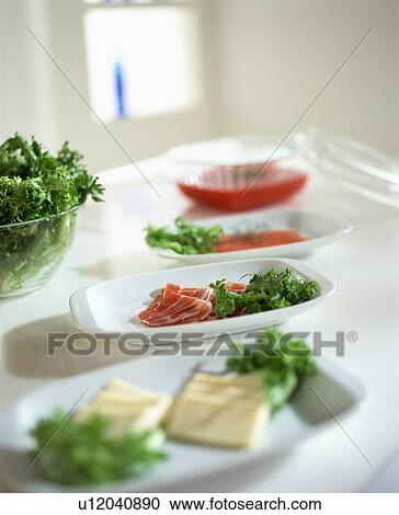 Stock Image - Appetizer dishes with salad. Fotosearch