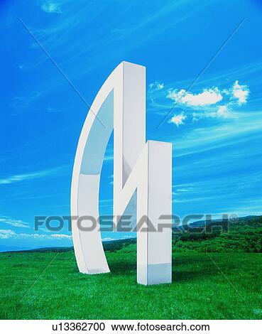 Stock Image - Art object in a green field. Fotosearch