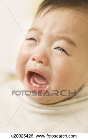Baby crying with mouth open View Large Photo Image Stock Photograph - Baby crying with mouth open. Fotosearch