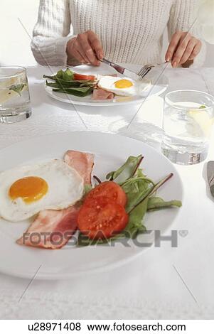 Bacon and egg meal with salad View Large Photo Image Stock Photo - Bacon and egg meal with salad. Fotosearch