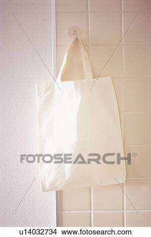 Bag hanging on wall View Large Photo Image Picture - Bag hanging on wall. Fotosearch