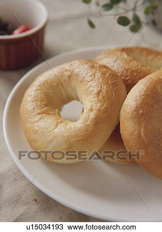 Stock Image - Bagels on white plate. Fotosearch