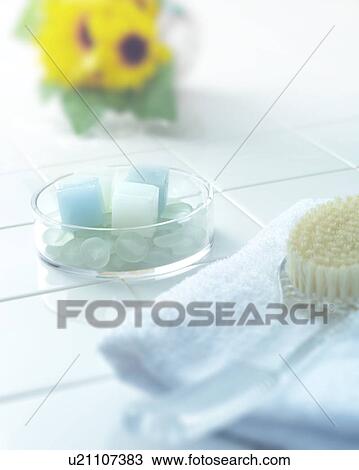 Stock Image - Bar of soap and back brush in a bathroom. Fotosearch