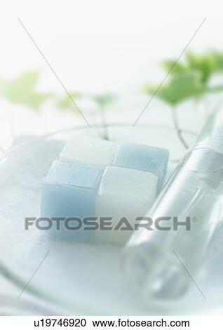 Stock Image - Bar of soap and spray bottle . Fotosearch