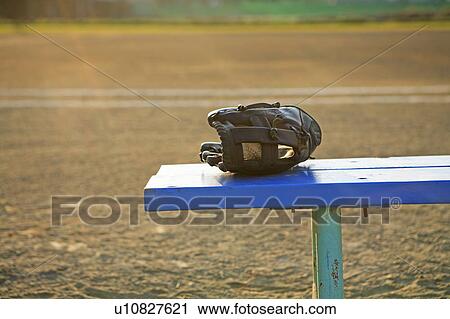 Baseball glove on bench View Large Photo Image Stock Image - Baseball glove on bench. Fotosearch