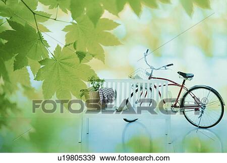 Stock Photo - Basket and magazine on seat with bicycle . Fotosearch