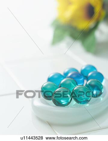 Stock Photo - Bath beads in the bathroom. Fotosearch