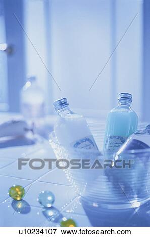 Bath products in tilted bathroom View Large Photo Image Stock Photo - Bath products in tilted bathroom. Fotosearch