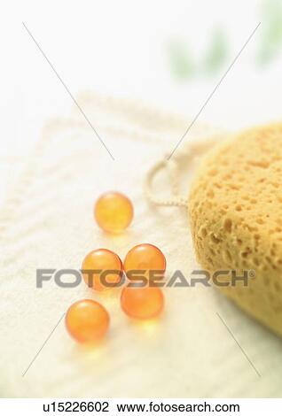 Stock Image - Bath sponge, bath beads and towel. Fotosearch