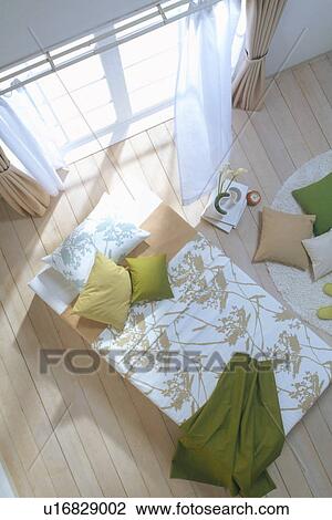 Stock Image - Bedroom with wooden floor. Fotosearch