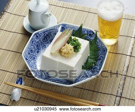 Stock Photography - Beer and bowl of bean curd. Fotosearch