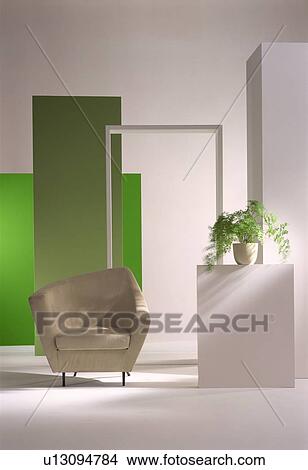 Beige armchair and pot plant in modern room View Large Photo Image Picture - Beige armchair and pot plant in modern room. Fotosearch