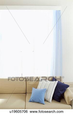 Beige sofa near window View Large Photo Image Stock Photograph - Beige sofa near window. Fotosearch