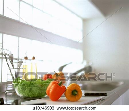 Bell peppers and lettuce on kitchen counter View Large Photo Image Stock Image - Bell peppers and lettuce on kitchen counter. Fotosearch