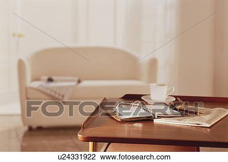 Belongings on table near sofa View Large Photo Image Stock Image - Belongings on table near sofa. Fotosearch