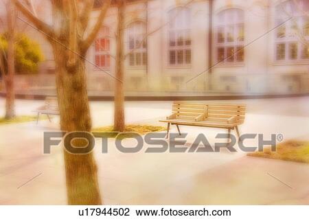 Stock Image - Bench and building in soft focus. Kyoto, Japan. Fotosearch