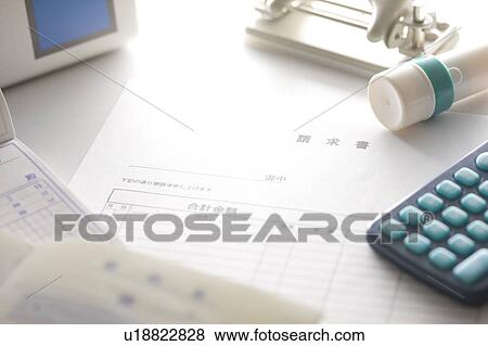 Bills next to a calculator and rubber stamp View Large Photo Image Stock Photo - Bills next to a calculator and rubber stamp. Fotosearch