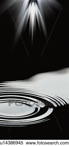 Stock Photography - Black illuminated rippled water. Fotosearch
